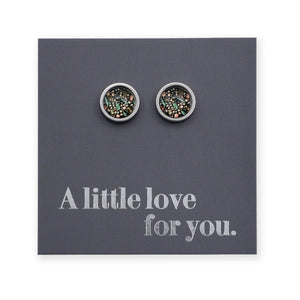 Pair of round earrings on a gray card with 'A little love for you.' text