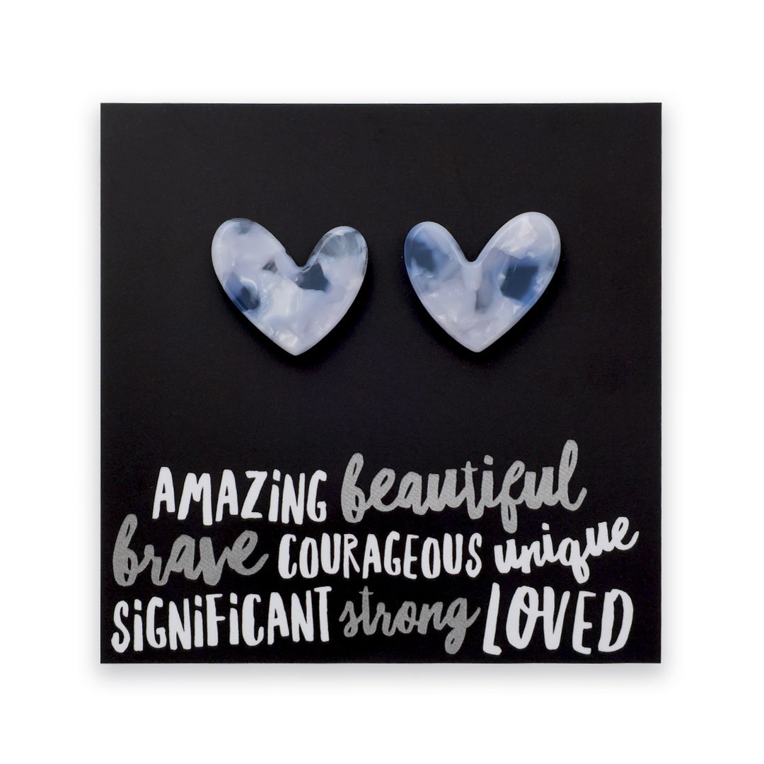 A square black art print or card featuring two marbled heart shapes above stylized white text reading 'AMAZING beautiful brave COURAGEOUS unique SIGNIFICANT strong LOVED'.