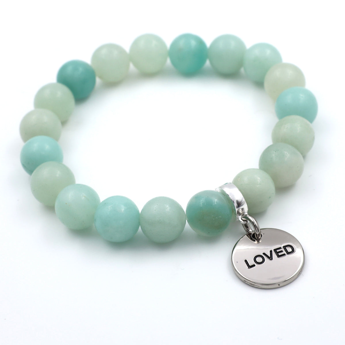 Turquoise beaded bracelet with a silver 'LOVED' charm on a white background
