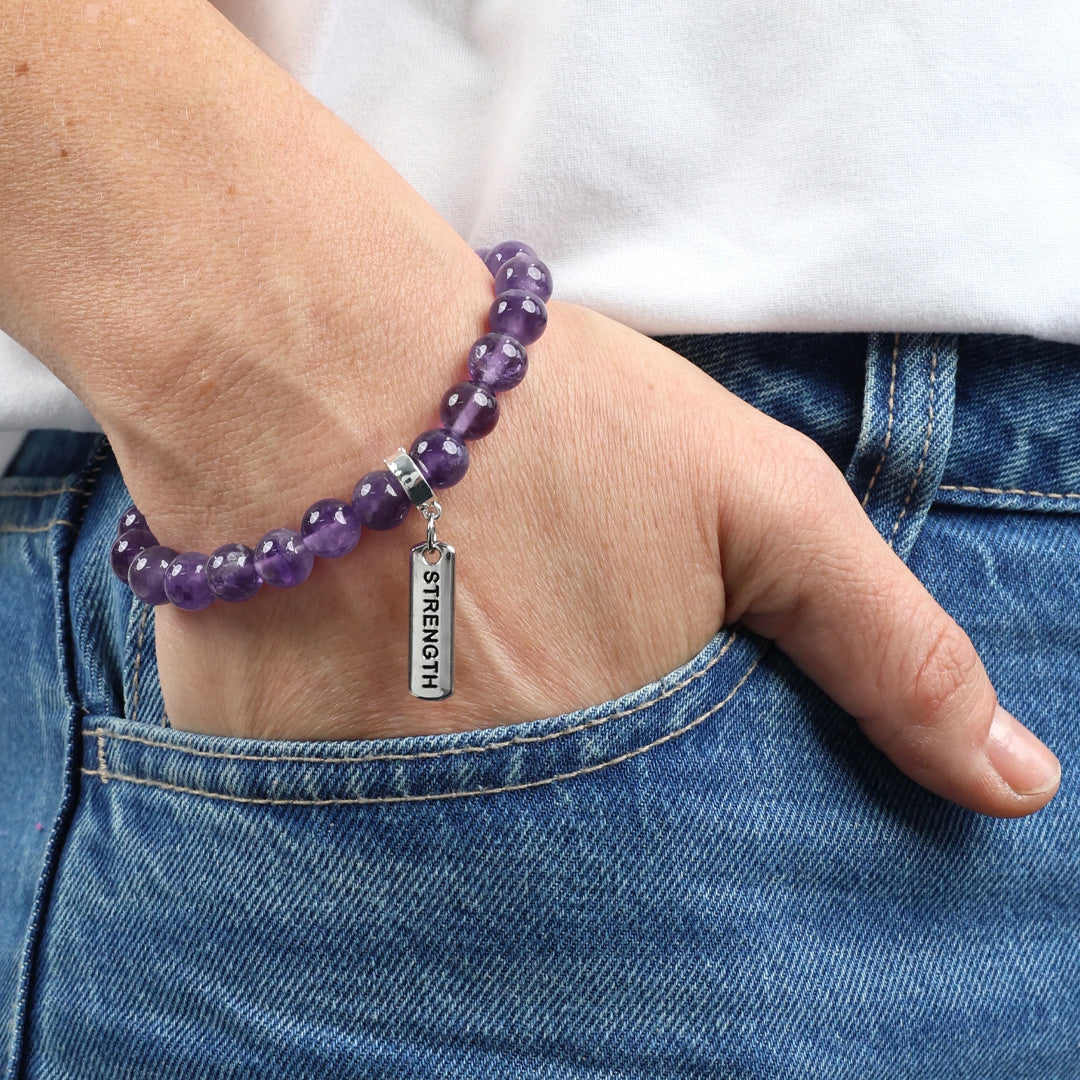 Purple amethyst stone bead bracelet with charm featuring meaningful and inspiring words with silver clip. 