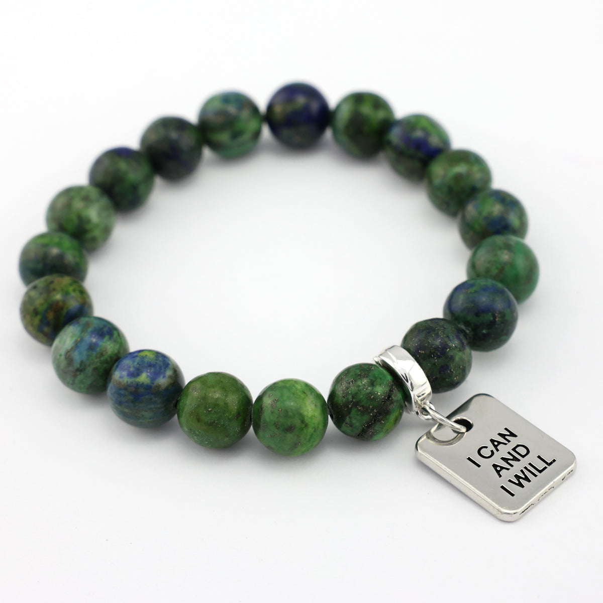 Green beaded bracelet with a silver tag on a white background