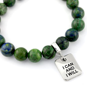 Green beaded bracelet with a silver charm reading 'I Can And I Will' on a white background