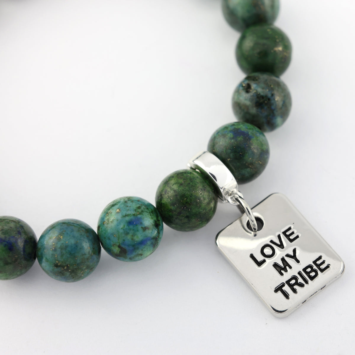 Green beaded necklace with a silver 'Love My Tribe' charm on a white background