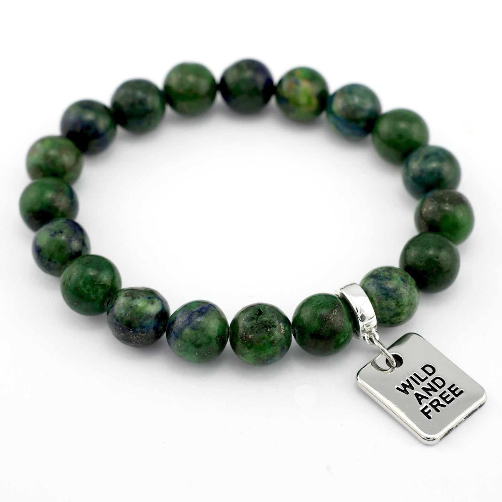 Green beaded bracelet with silver charms on a white background