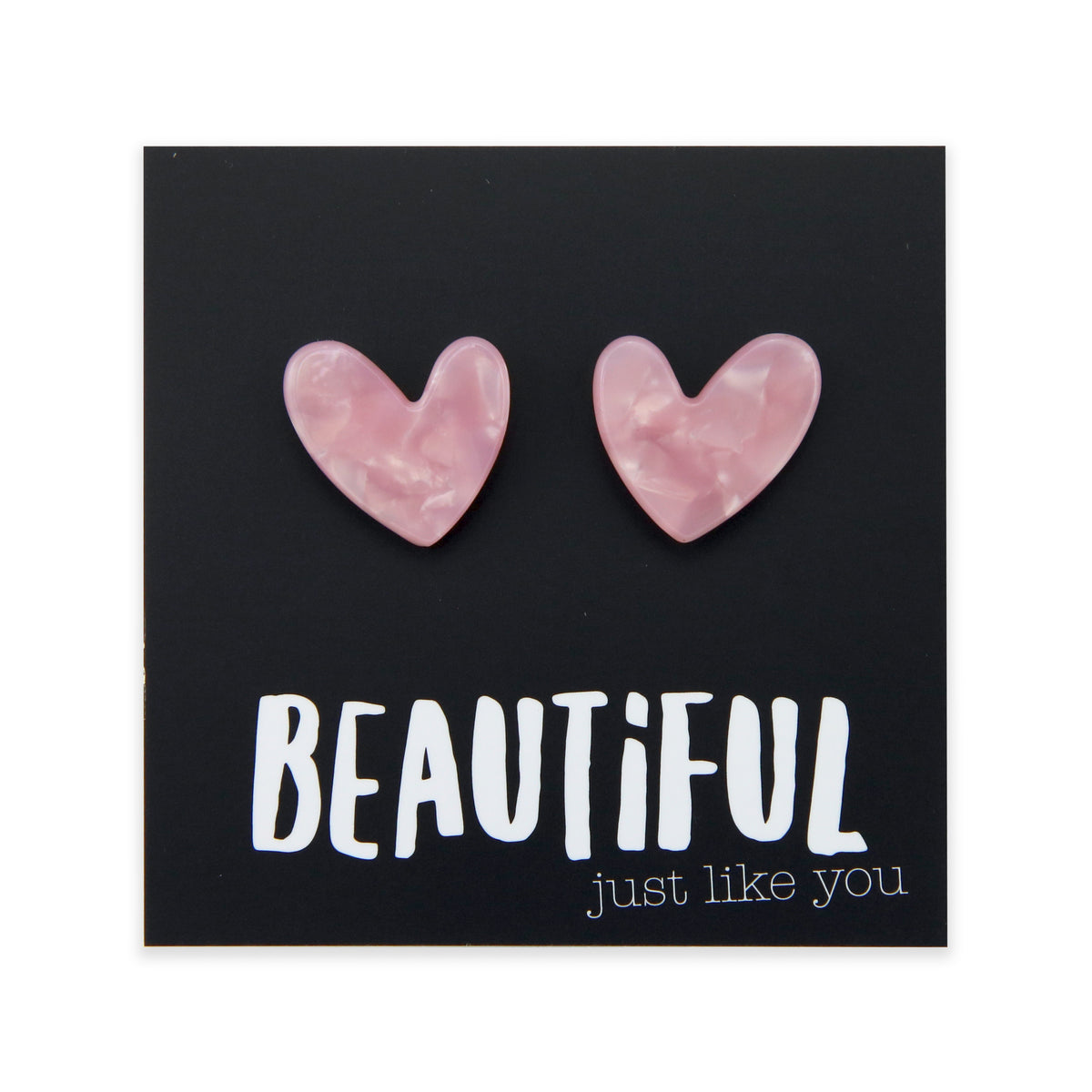 Heart-shaped pink earrings on a black card with 'BEAUTiFUL just like you' text.
