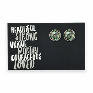 Pair of round earrings on a card with motivational text