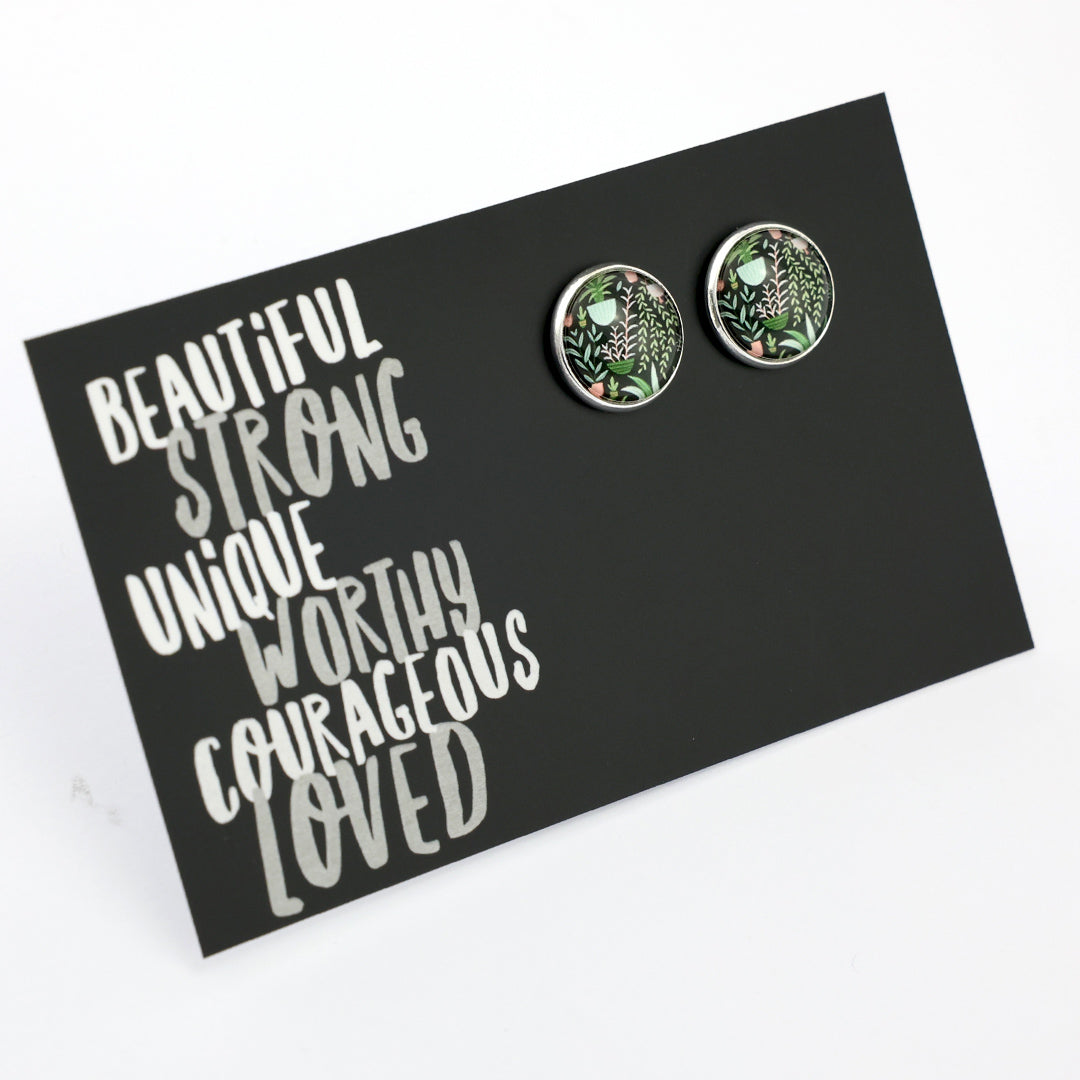 Pair of round earrings on a card with motivational text