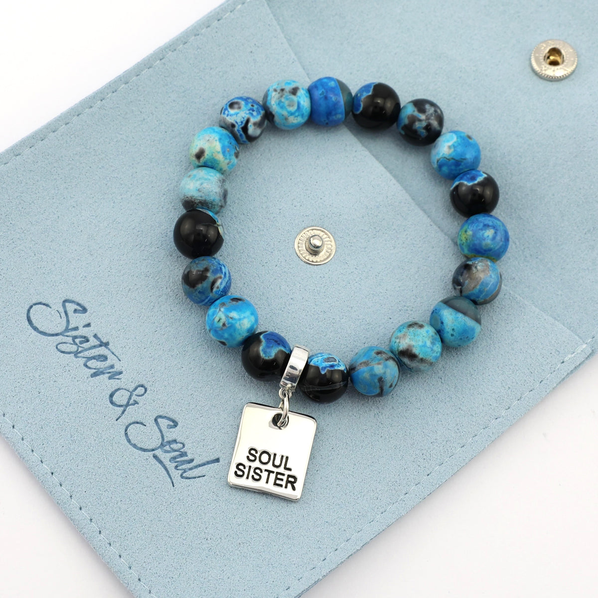 Beaded bracelet with 'Soul Sister' charm on a blue card, featuring the brand 'Sister & Soul'.