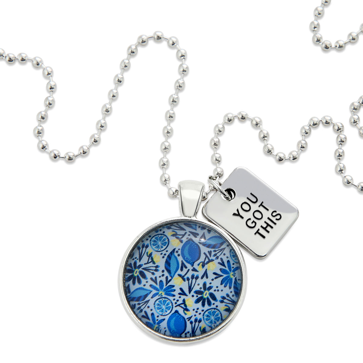 Necklace with blue floral pendant and 'You Got This' tag on a white background