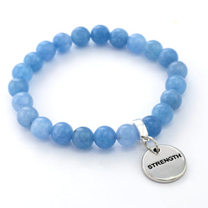Blue beaded bracelet with a 'STRENGTH' charm on a white background