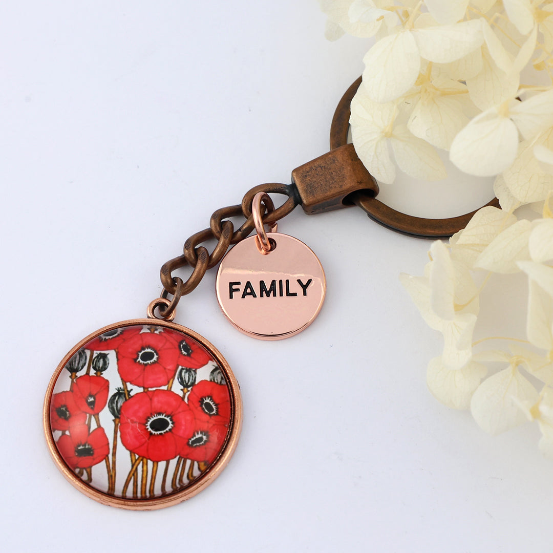 Keychain with red floral design and 'FAMILY' tag on a white background