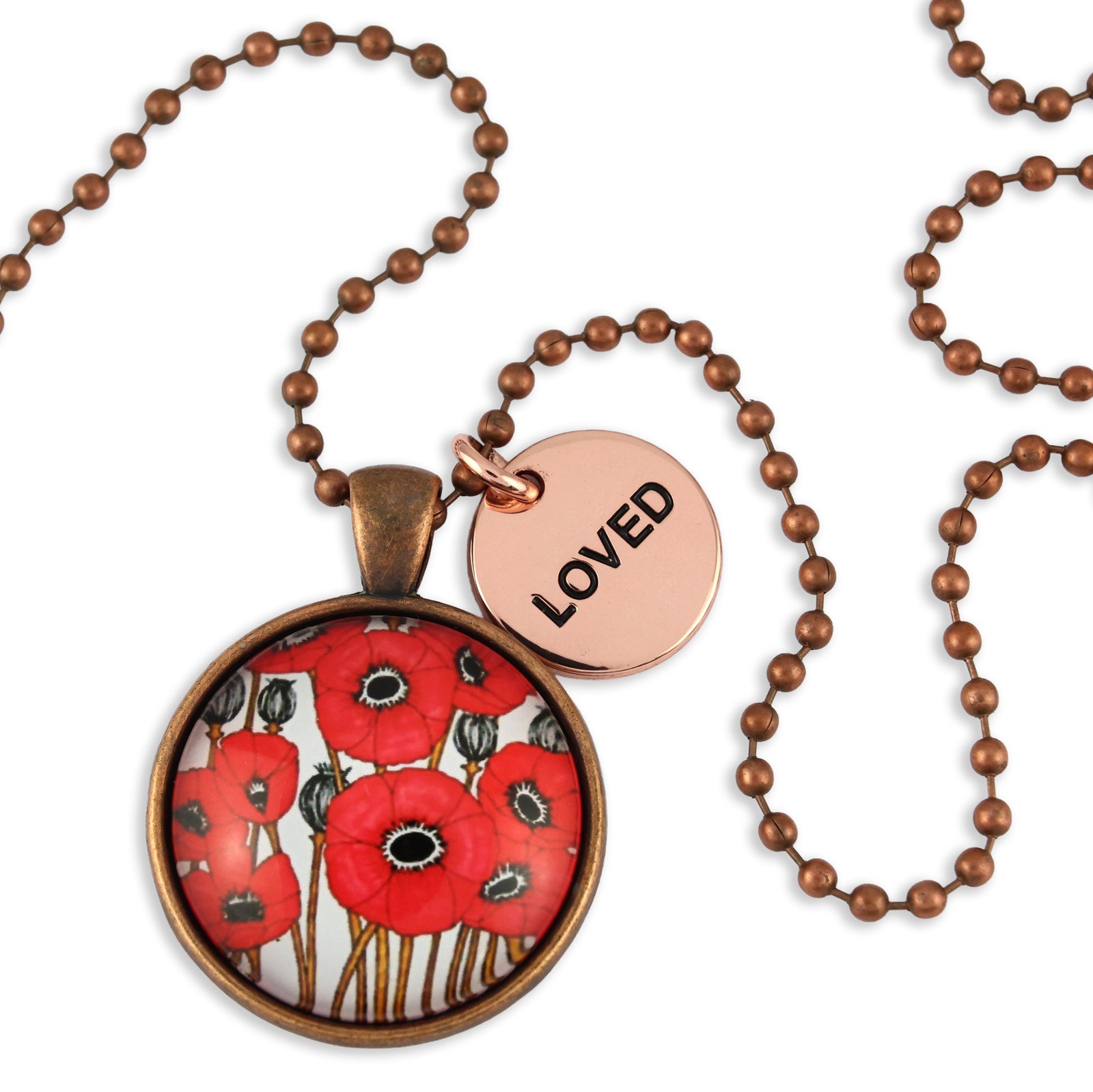 Necklace with a round pendant featuring red floral design and a round tag with 'LOVED' on a white background.