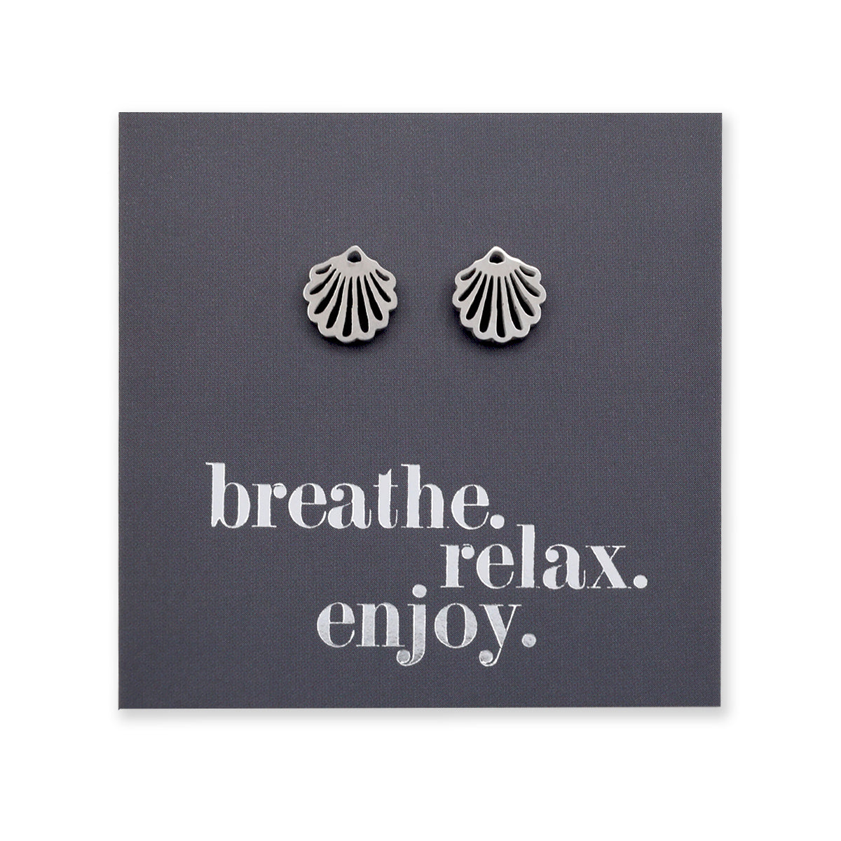 Silver scallop shell earrings on a dark gray card with 'breathe. relax. enjoy.' text.