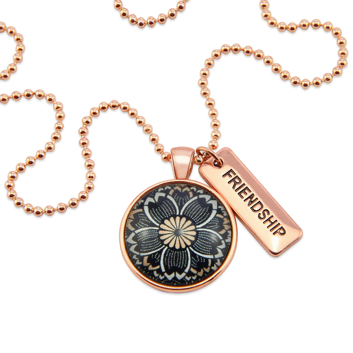 Necklace with floral pendant and 'FRIENDSHIP' tag on a white background