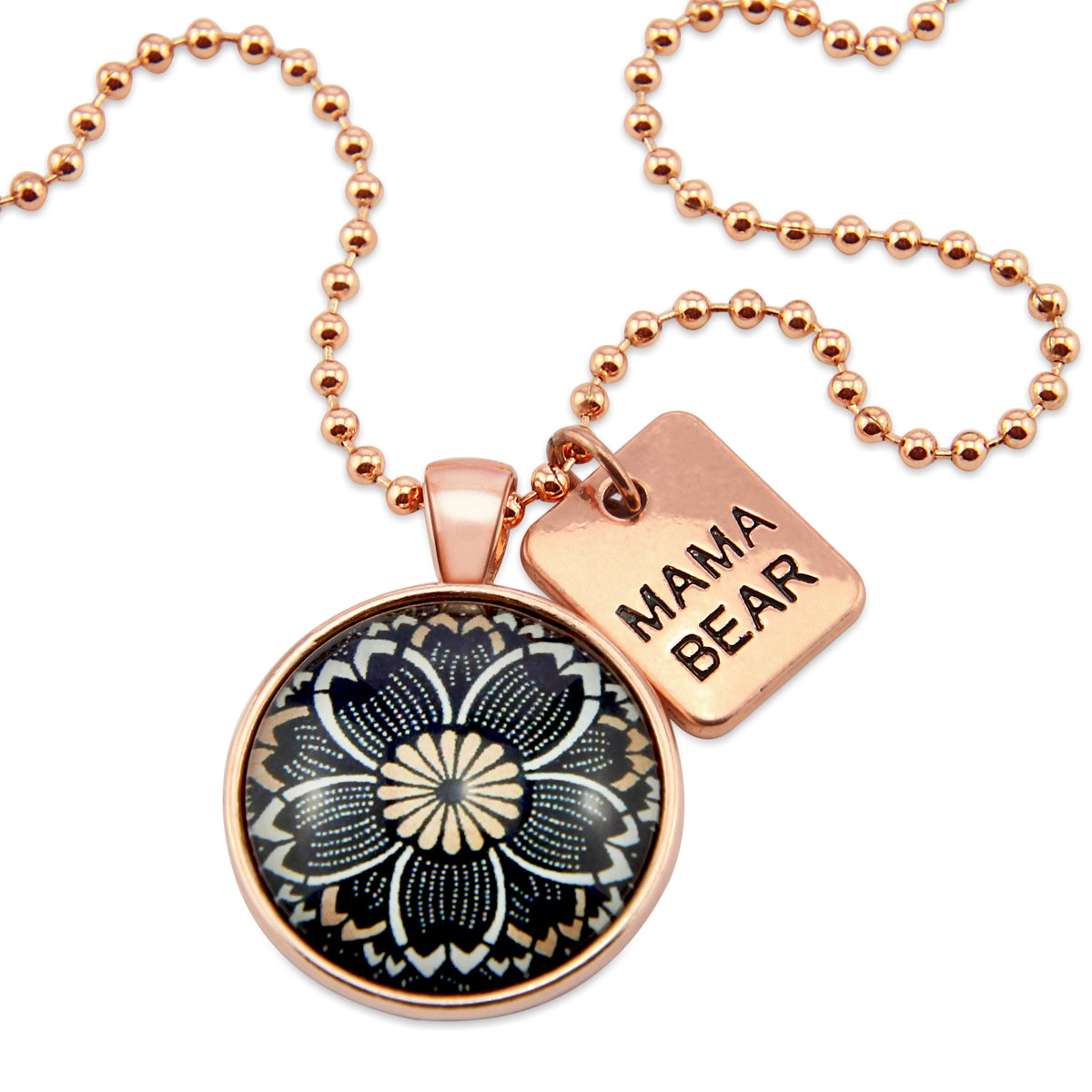 Necklace with 'Mama Bear' tag and black floral pendant on a white background