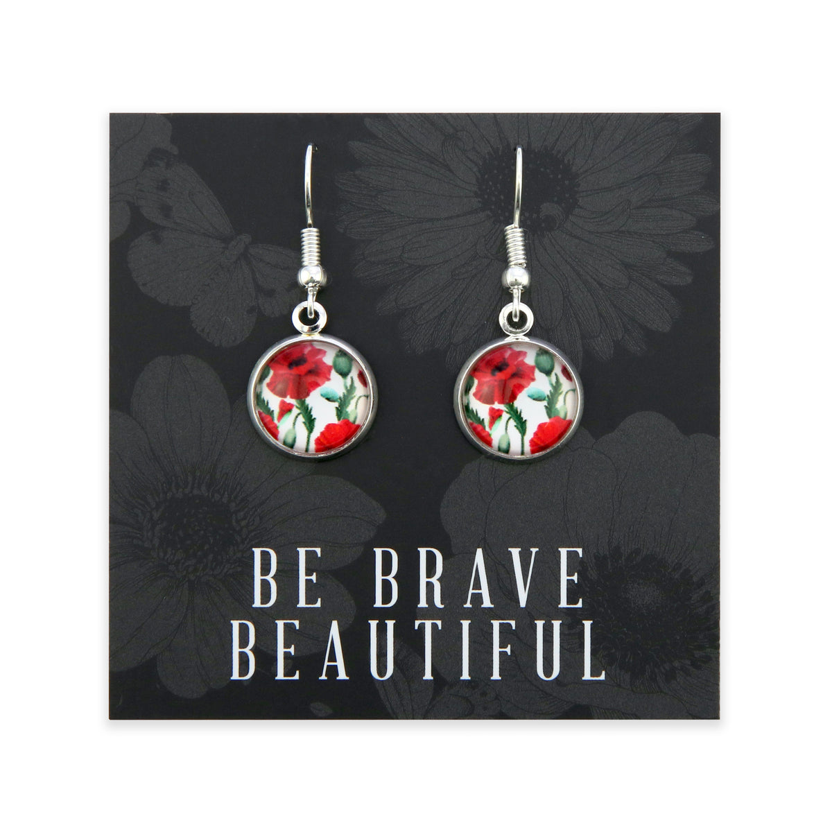 Earrings with floral design on a card with 'Be Brave Beautiful' text, black floral background