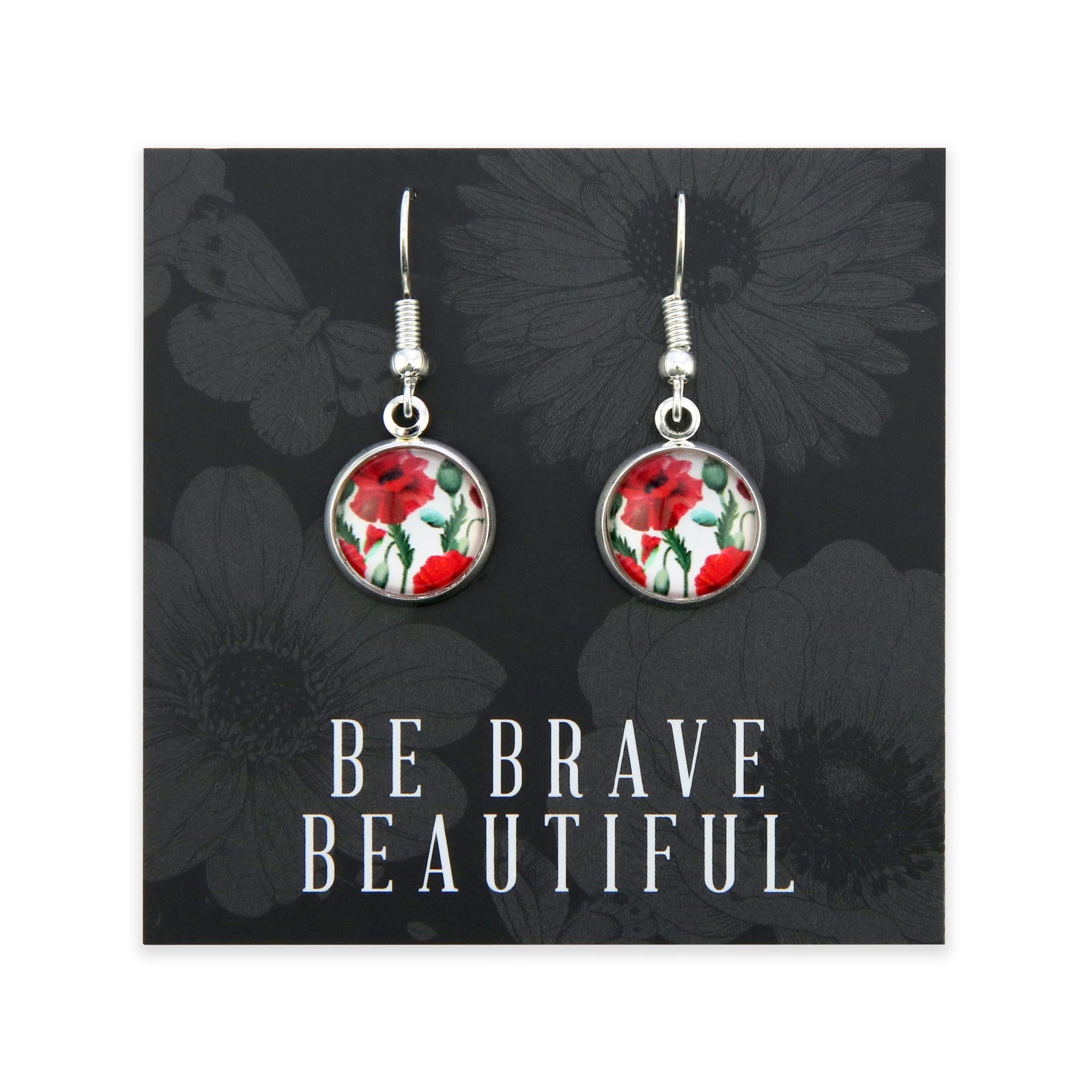 Earrings with floral design on a card with 'Be Brave Beautiful' text, black floral background