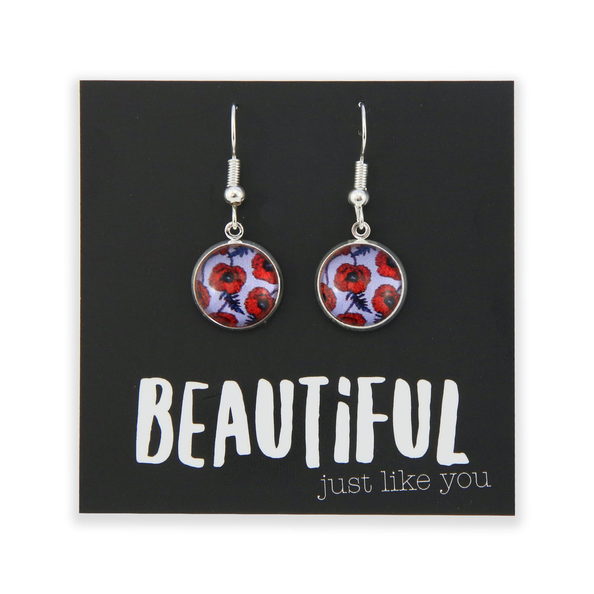 Pair of earrings with floral design on a card with motivational text