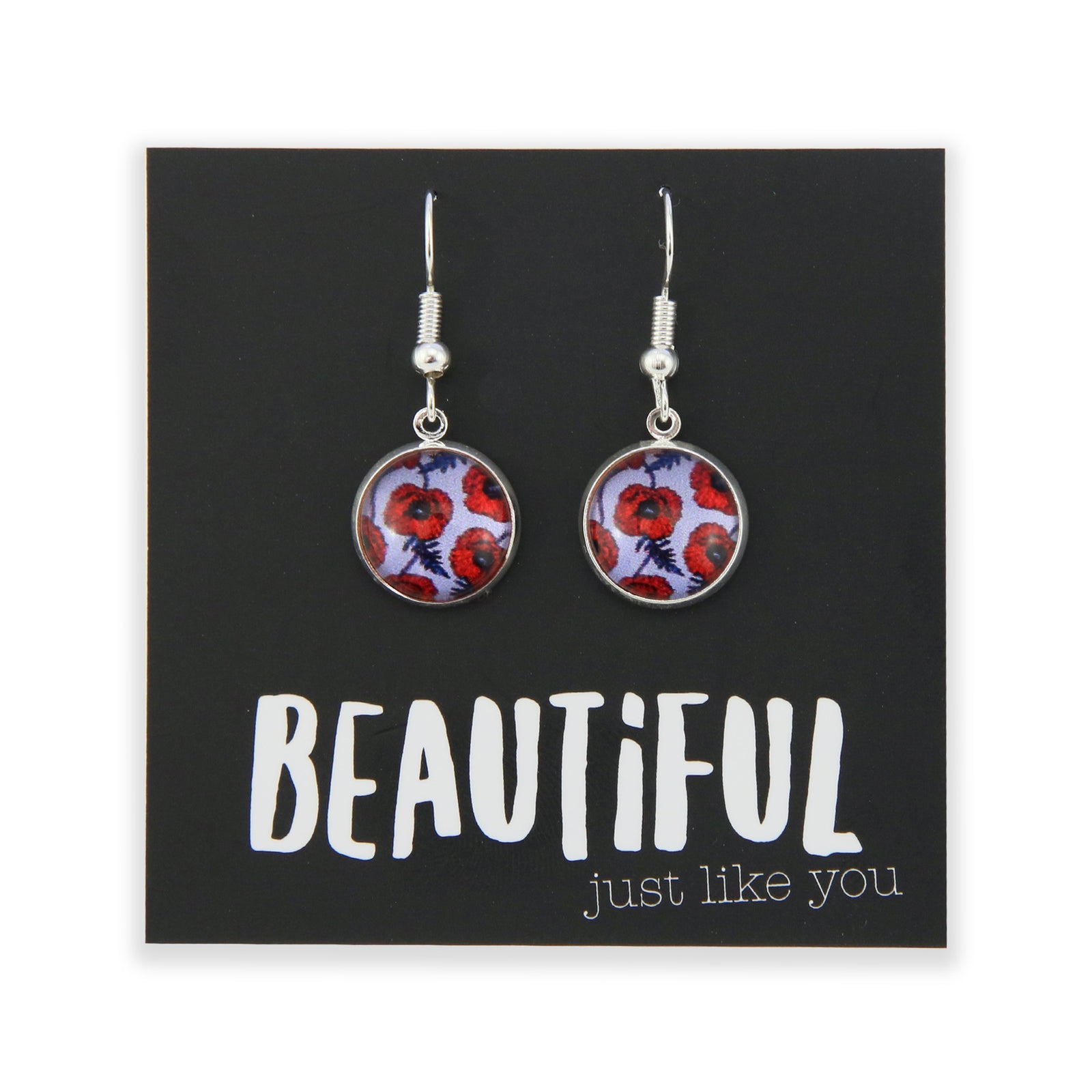 Pair of earrings with floral design on a card with motivational text