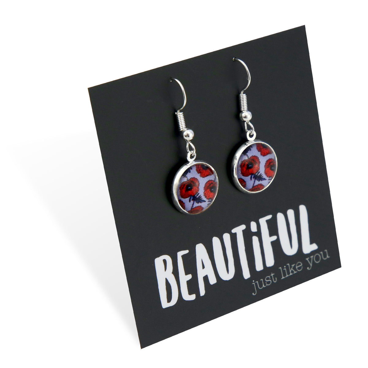 Earrings on a card with 'Beautiful just like you' text