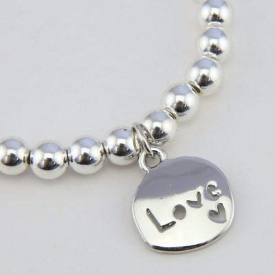 Christmas Bracelet - Silver Hematite 6mm Bracelet with Bright Silver Word Charm