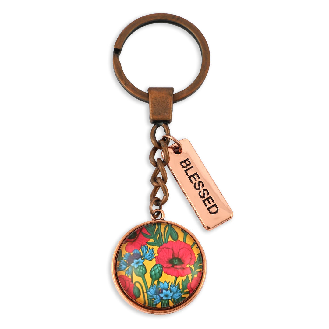Keychain with floral design and 'Blessed' tag on a white background