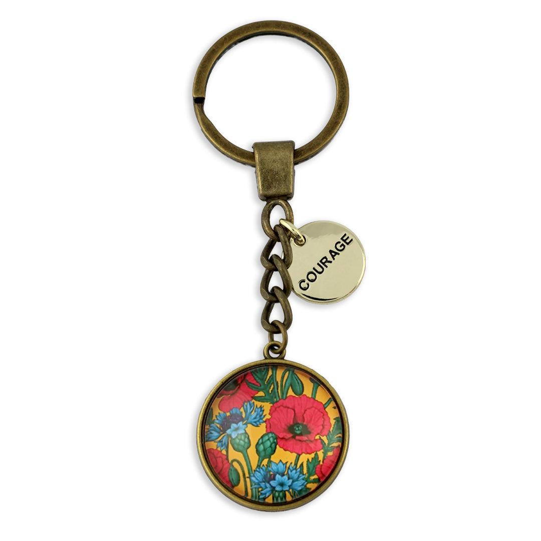 Keychain with floral design and 'COURAGE' tag on a white background