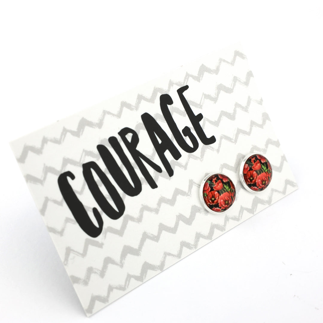 Red floral stud earrings on a 'Courage' card with zigzag pattern