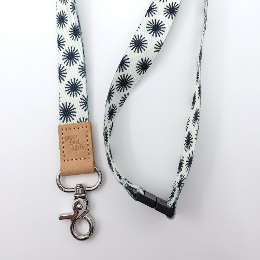 Lanyard with black star pattern on a white background