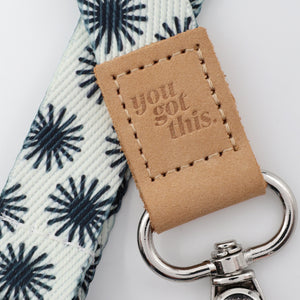 Keychain with 'you got this.' tag on a floral-patterned strap