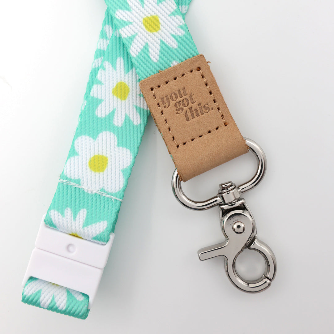 Lanyard with floral pattern and 'you got this' leather tag on a white background