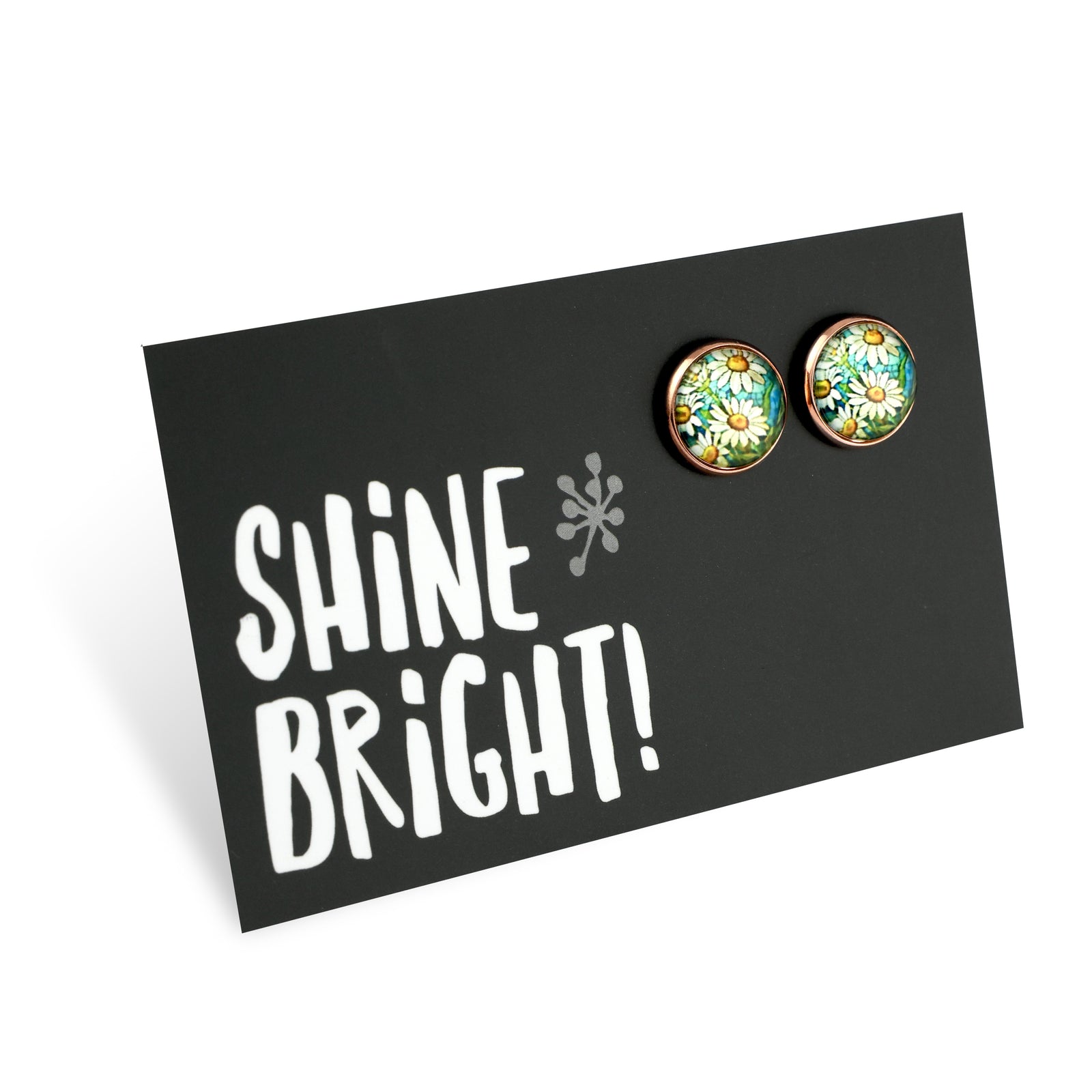 Floral earrings on a card with 'Shine Bright!' text