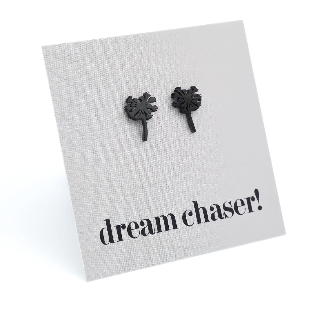 Black dandelion seed earrings on a 'dream chaser!' card