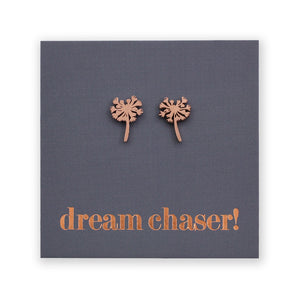 Copper dandelion-shaped earrings on a dark gray card with 'dream chaser!' text.