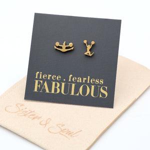 Cheer leader shaped Gold earrings on a card with 'fierce fearless FABULOUS' text, displayed on a beige mat.