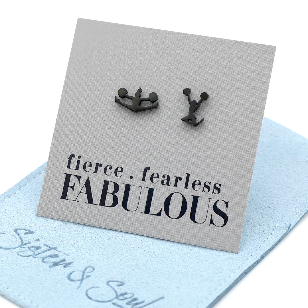 Cheer leader shaped Black earrings on a card with 'fierce fearless FABULOUS' text, placed on a light blue surface.