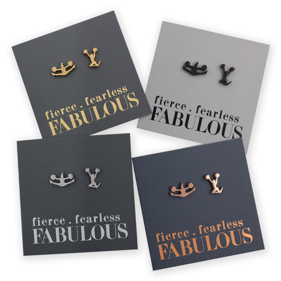 Four pairs of cheer girl shape earrings on cards with 'fierce fearless FABULOUS' text.