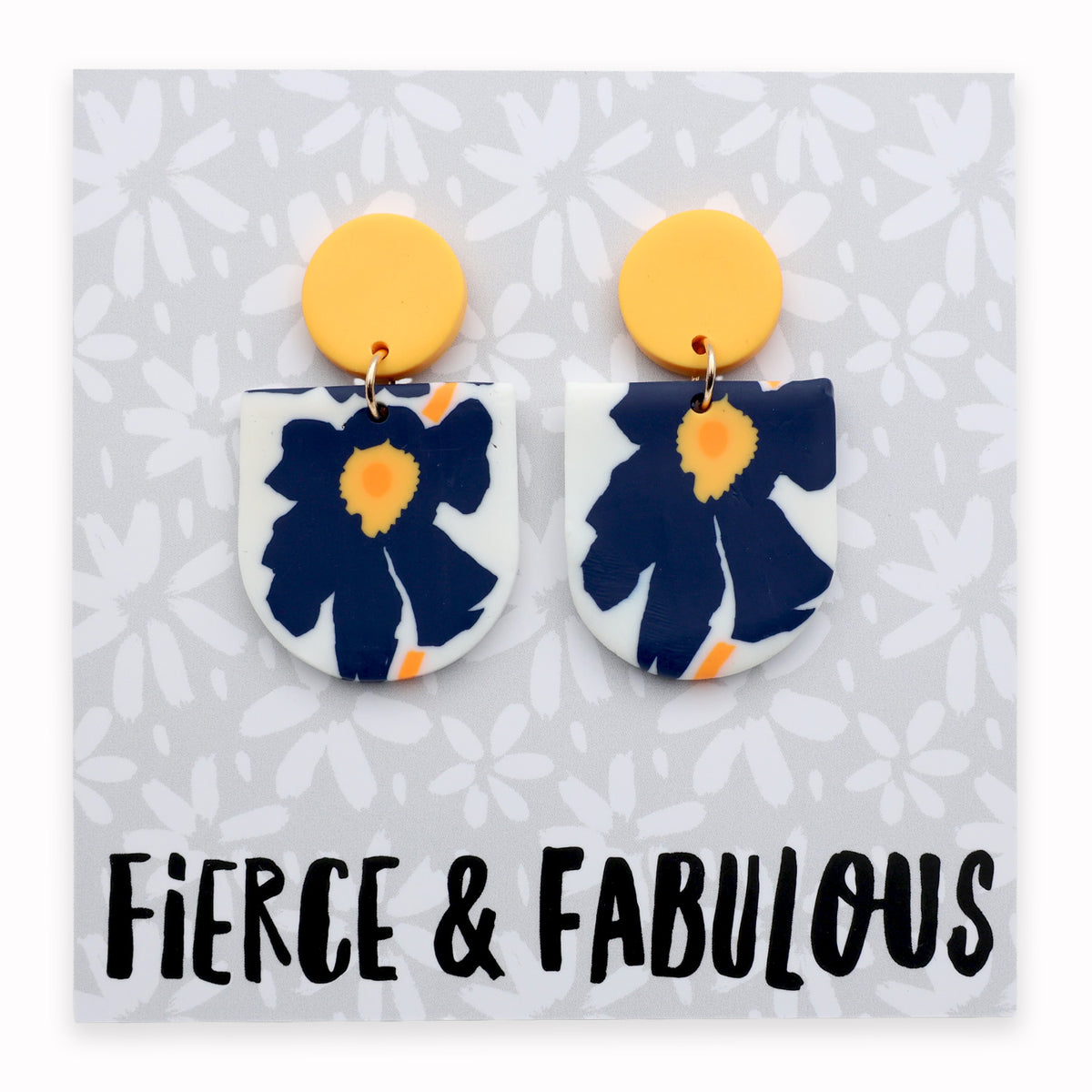 Floral earrings with yellow tops on a card labeled 'Fierce & Fabulous'.