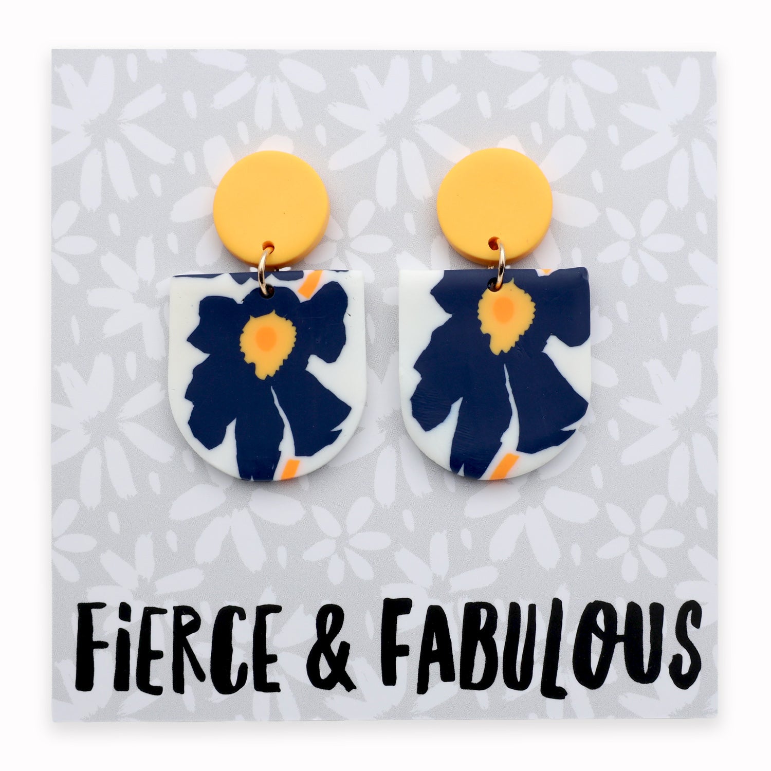 Floral earrings with yellow tops on a card labeled 'Fierce & Fabulous'.