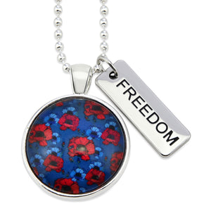 Necklace with floral pendant and 'FREEDOM' tag on a white background