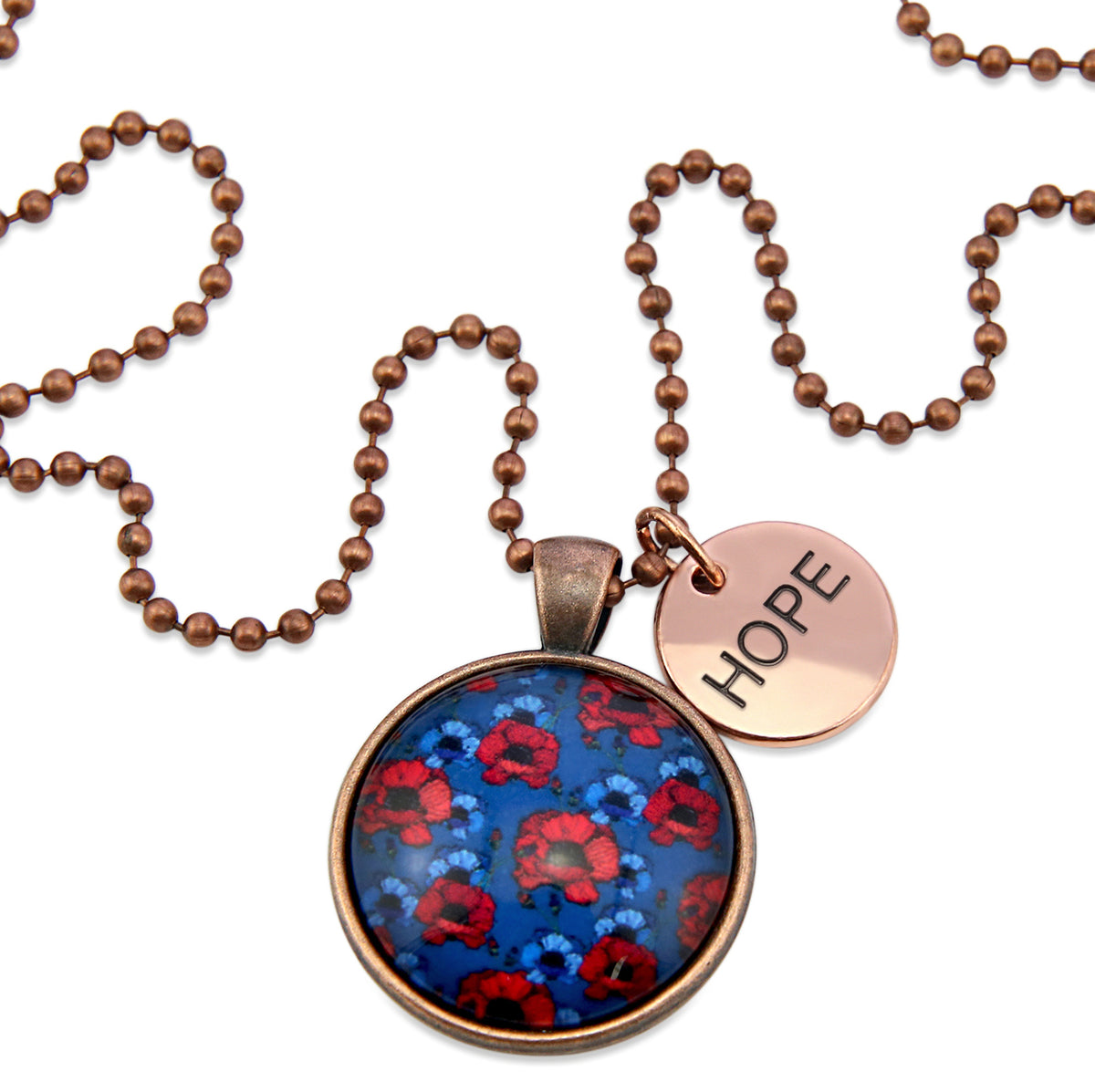 Necklace with floral pendant and 'HOPE' tag on a white background