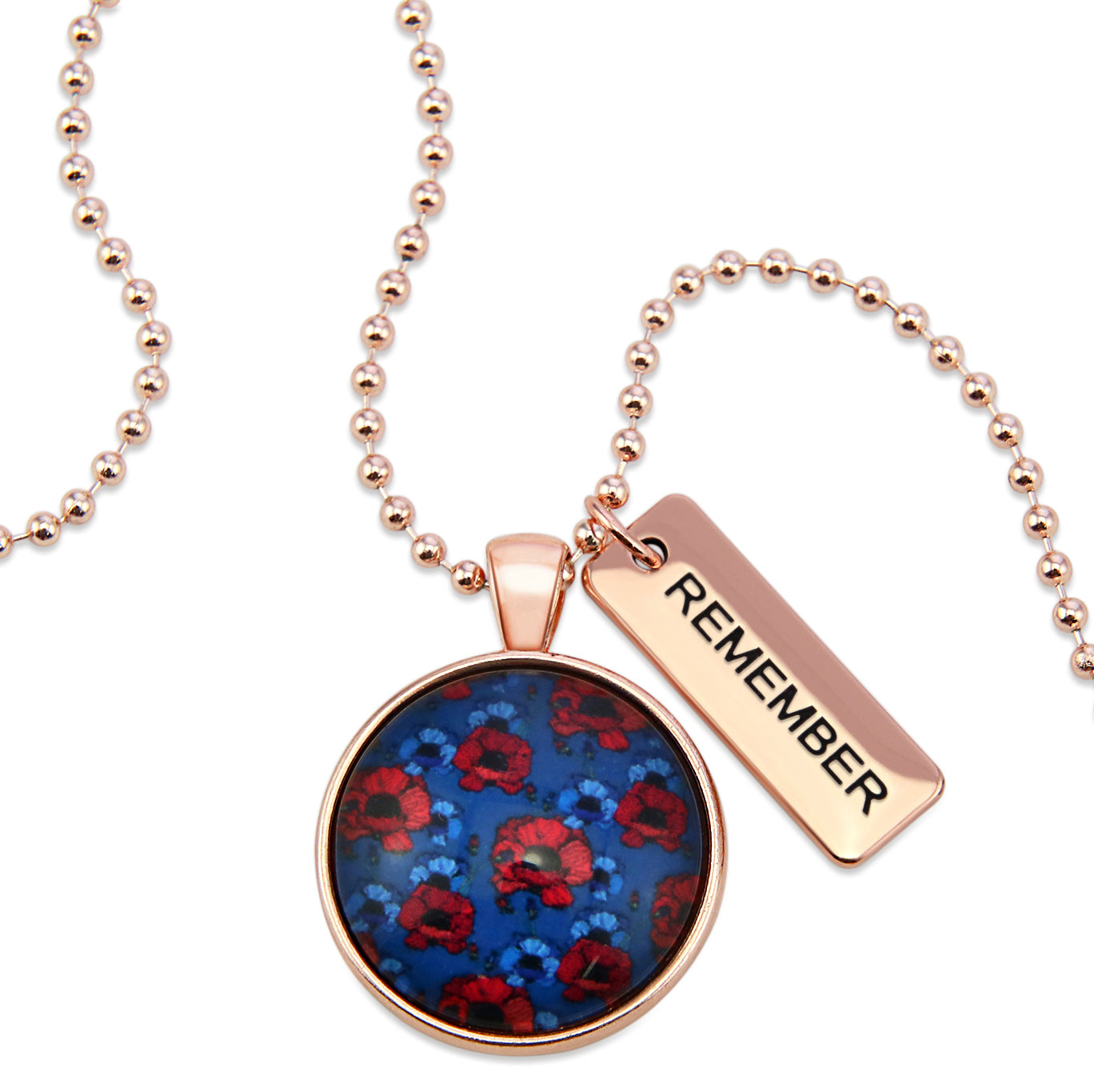 Necklace with floral pendant and 'REMEMBER' tag on a white background