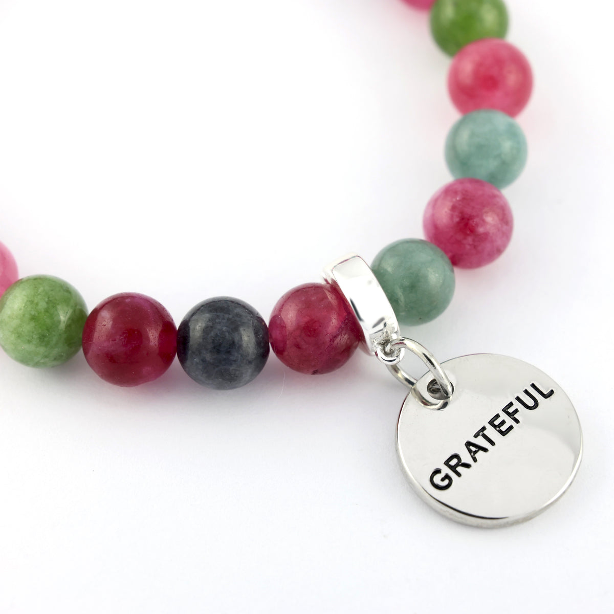 Bracelet with multicolored beads and a 'GRATEFUL' charm on a white background