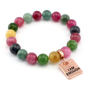 Multicolored beaded bracelet with a 'I AM ENOUGH' charm on a white background