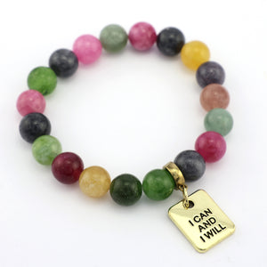 Multicolored beaded bracelet with a gold 'I Can and I Will' charm on a white background