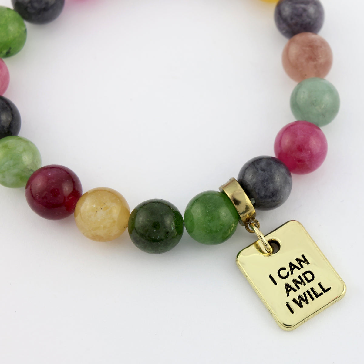 Colorful beaded necklace with a gold 'I Can And I Will' charm on a white background