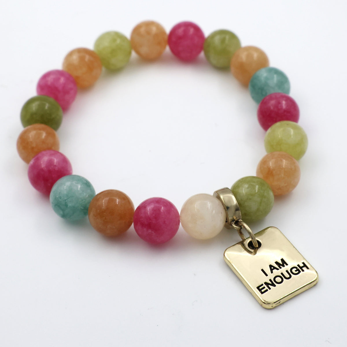 Multicolored beaded bracelet with a gold tag reading 'I AM ENOUGH' on a white background