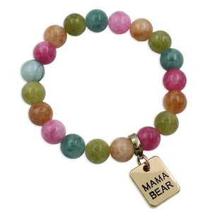 Multicolored beaded bracelet with a 'MAMA BEAR' charm on a white background