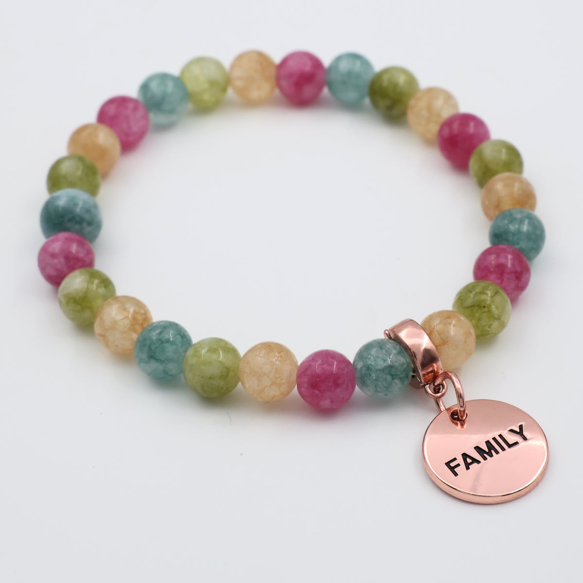 Multicolored beaded bracelet with a 'FAMILY' charm on a white background