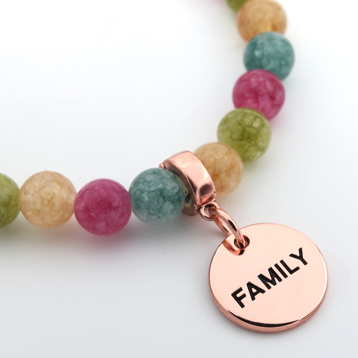 Necklace with multicolored beads and a rose gold 'FAMILY' charm on a white background